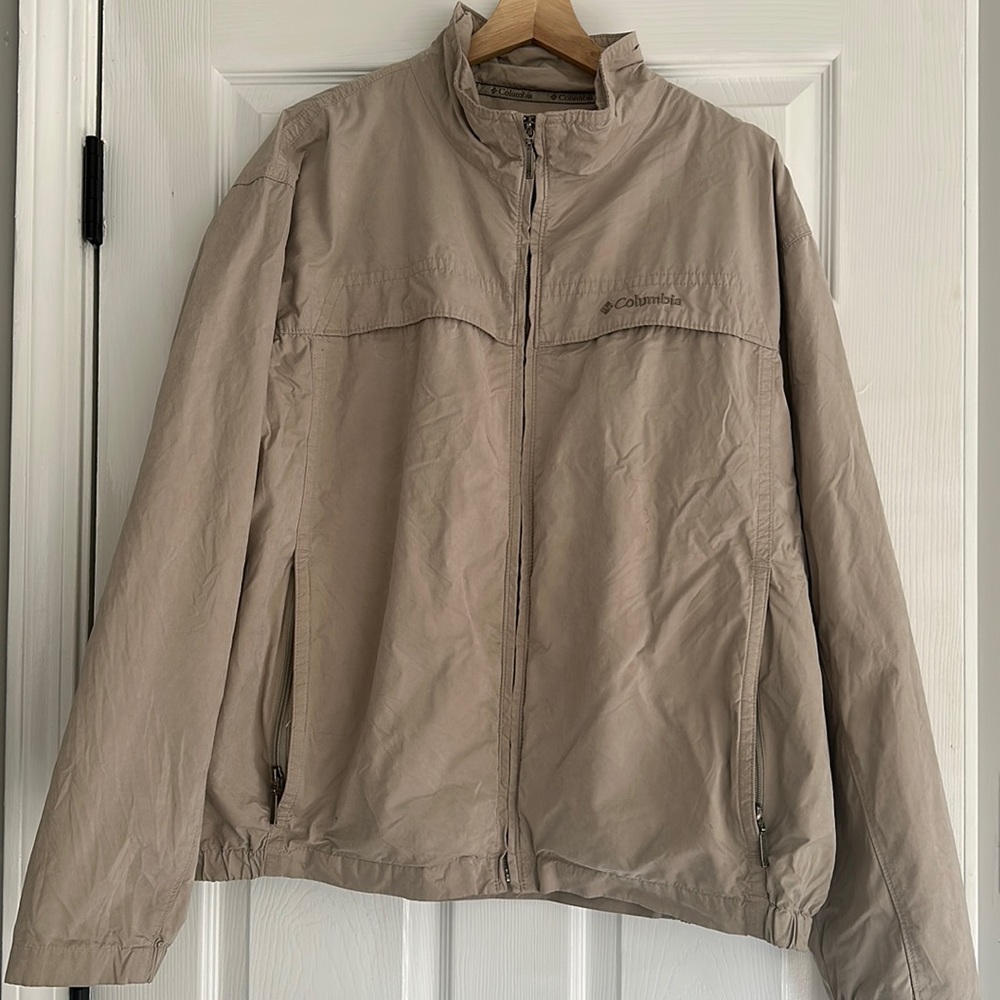 Columbia windbreaker jacket. Small stain on left arm area.